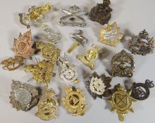 Twenty assorted regimental cap badges