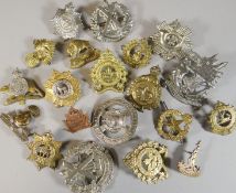 Twenty assorted regimental cap badges