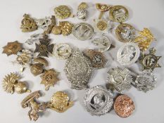 Thirty assorted regimental cap badges