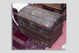 A wooden banded dome topped faux crocodile trunk with metal fittings