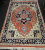 An Eastern pink and blue rug, in excellent condition, purchased in the US in 1989, 9ft x 6ft