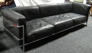 A late twentieth century three-seater black leather and chrome settee after a design by Le