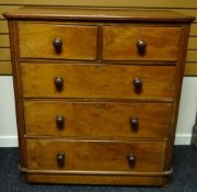 A Victorian mahogany chest of three long and two short drawers and with turned knobs