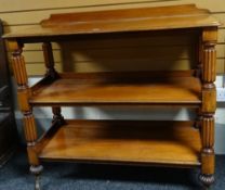 A good Victorian mahogany three-tier rail-back dumb-waiter on reeded corner supports, 47ins wide x