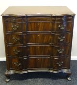 An early 20th Century Dutch style mahogany chest of four long drawers with brush slide and having