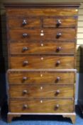 A Victorian mahogany chest on chest, the upper section having three long and two short drawers on