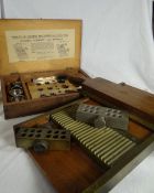 A pharmacist`s vintage pill-roller in brass and mahogany together with a brass capsule maker and a
