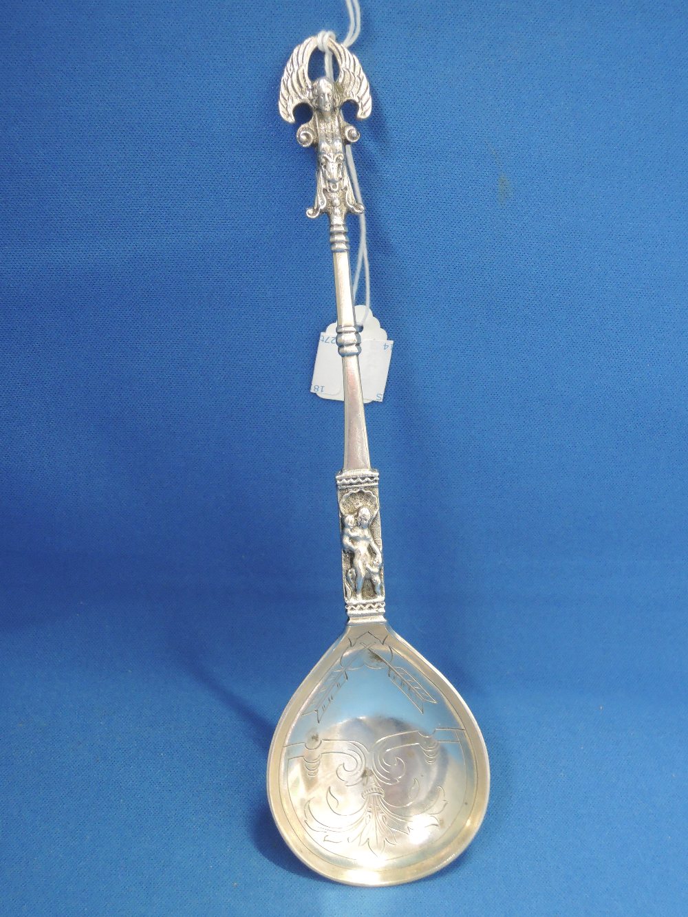 A Continental white metal spoon stamped 830 having religious/cherubic decoration - Image 2 of 2