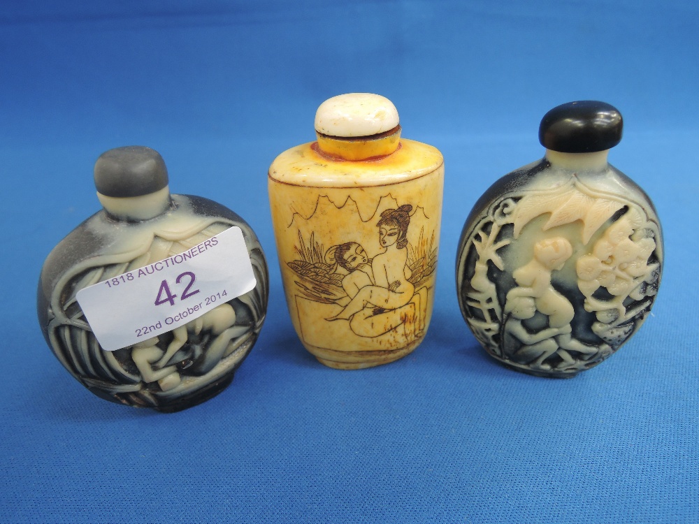 Three modern resin reproduction oriental scent bottles having erotic decoration