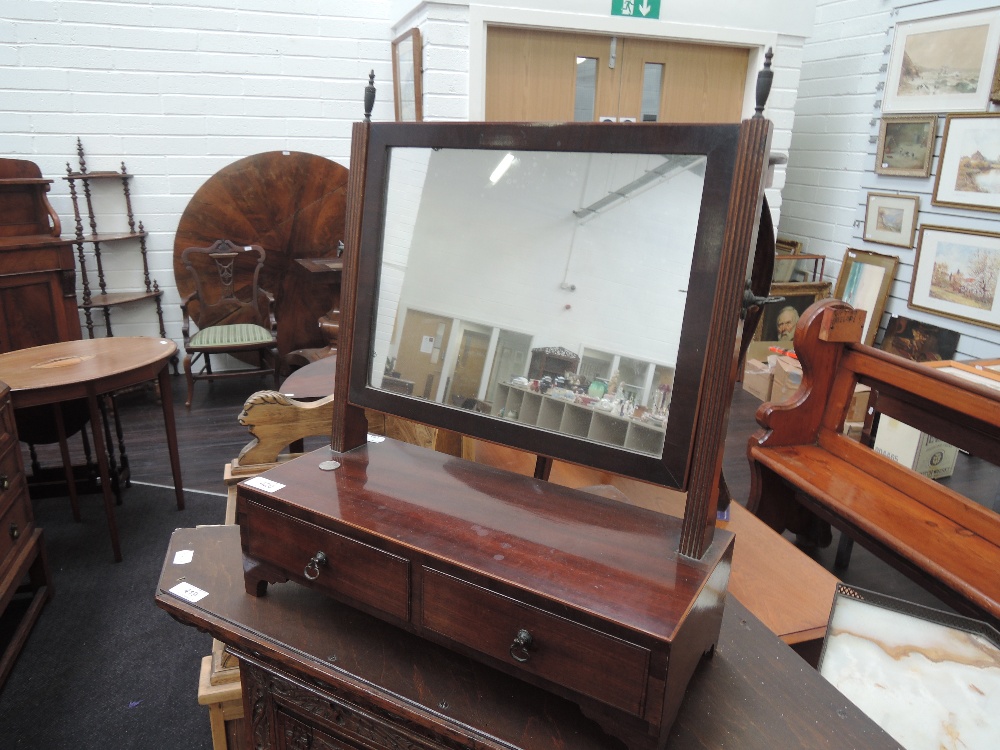 A 19th century mahogany toilet/swing mirror having rectangular top over two frieze drawers