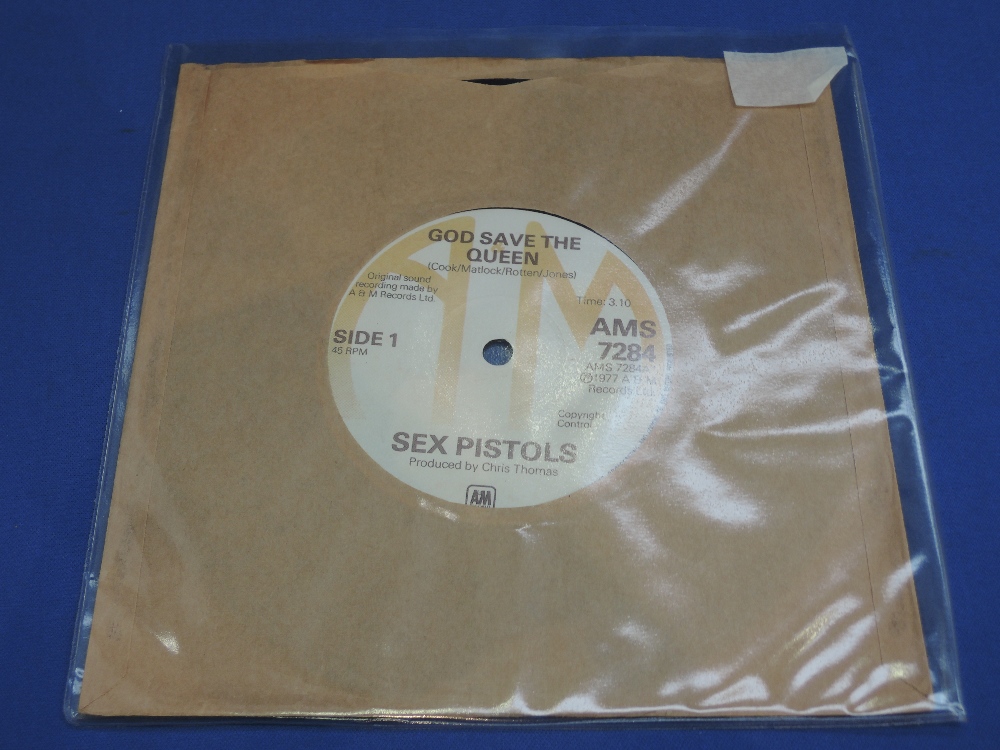 A vinyl LP single, The Sex Pistols demo, `God Save The Queen`, bears label AMS7284, believed to be