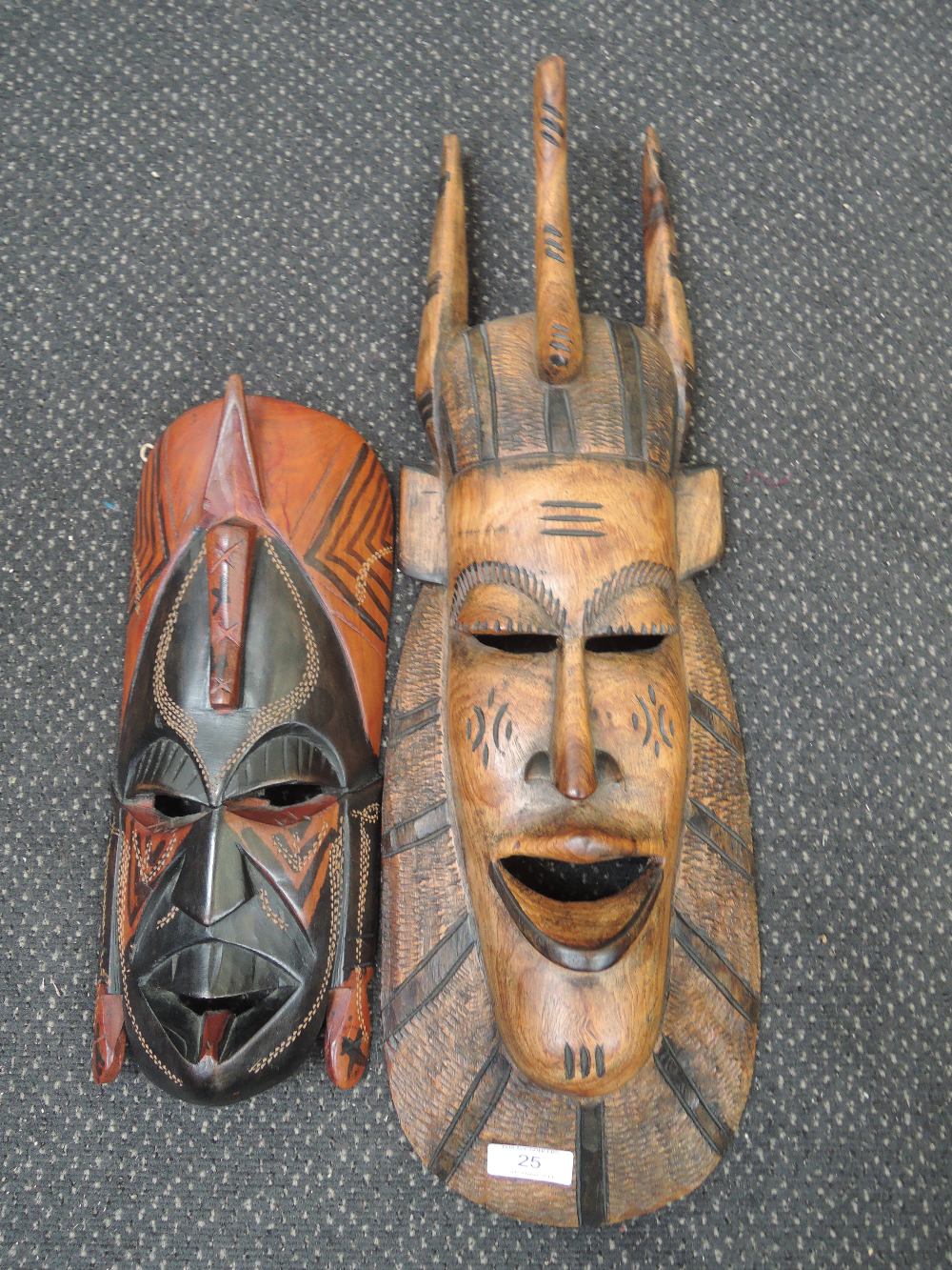 Two treen African tribal art masks, marked Kenya