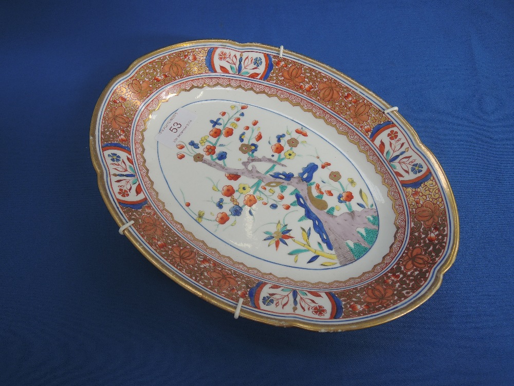 A late 19th century Imari dish of oval design having gilt heightened floral cartouche numbered 282