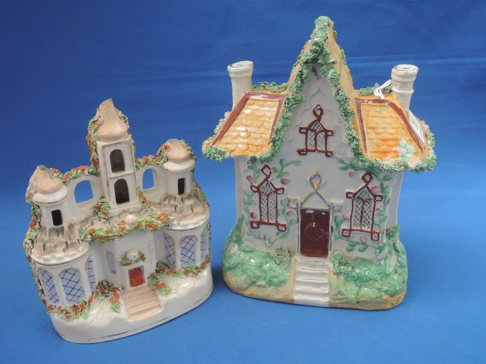 A 19th century Staffordshire cottage of traditional design and similar Staffordshire figure