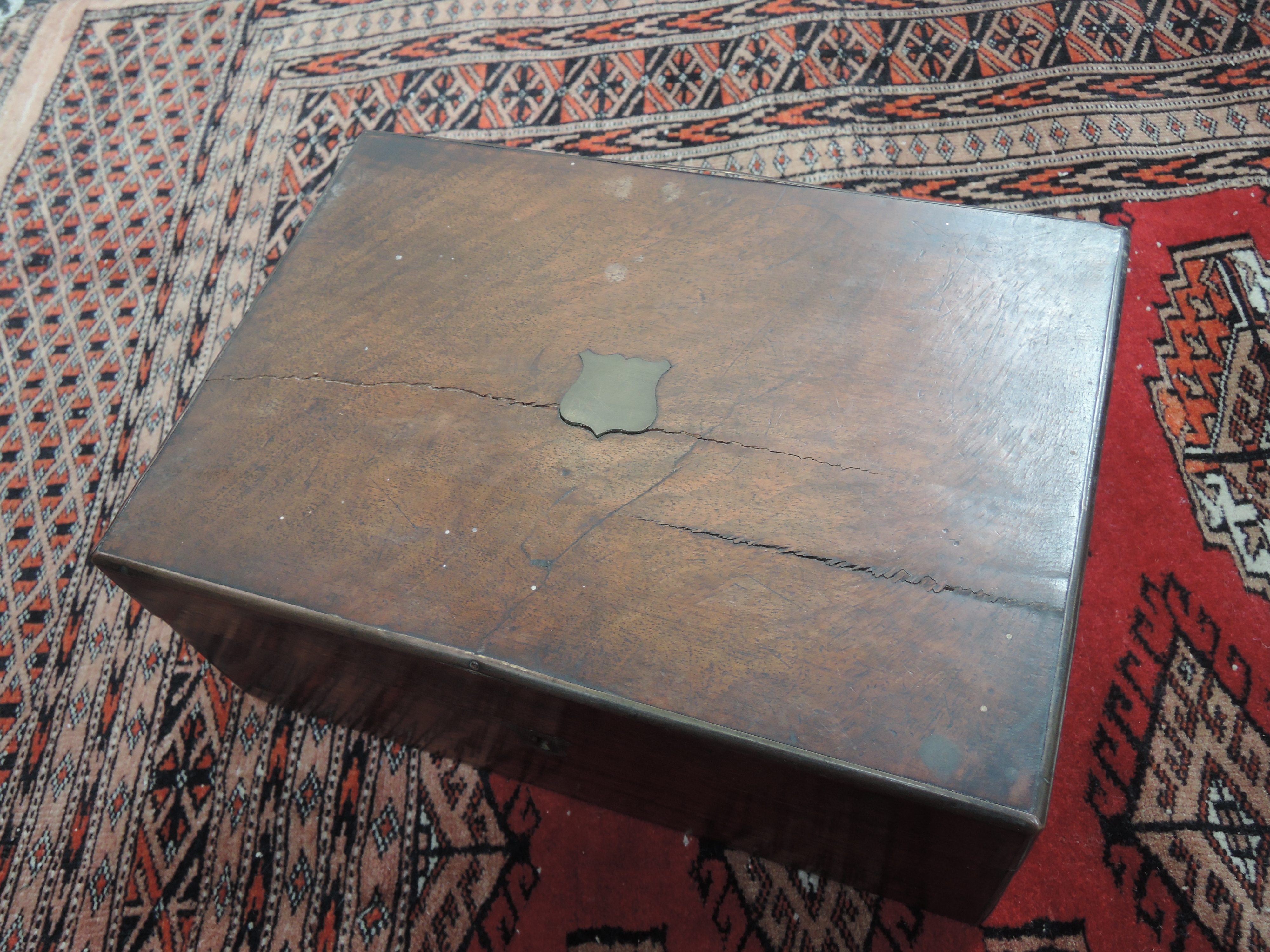 A Victorian mahogany lap desk/writing slope having fitted interior
