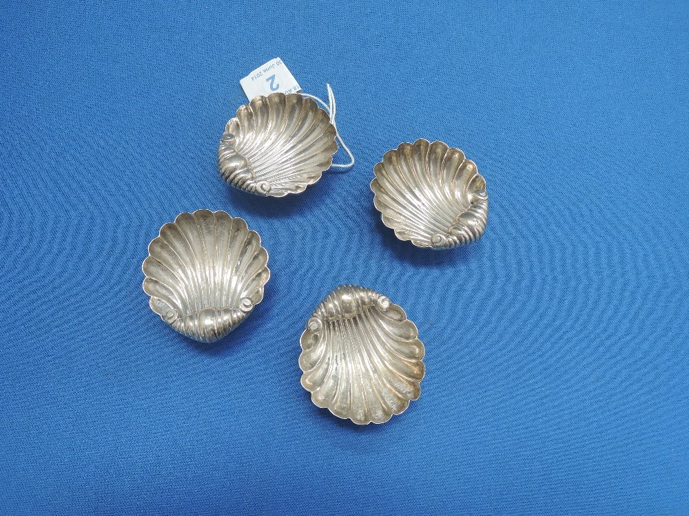 A set of four silver salts in the form of clam shells on trefoil bun feet (no spoons), Birmingham