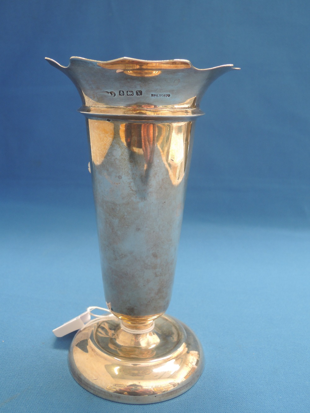 A silver bud vase having fluted rim, Birmingham 1920, makers marks worn