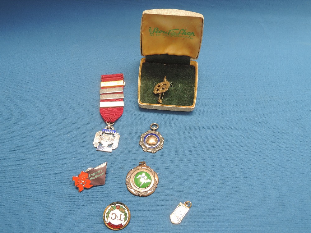 A selection of medals, pins and brooches including HM silver, London Olympics and Scouting interest