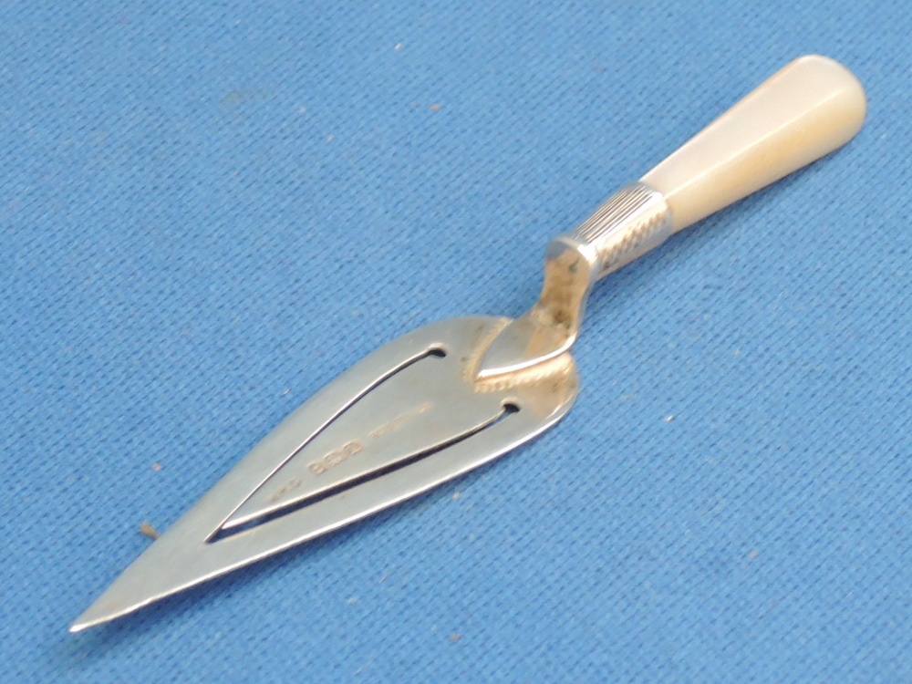 A silver book mark modelled as a trowel having a mother of pearl handle,  Birmingham 1934,  W H