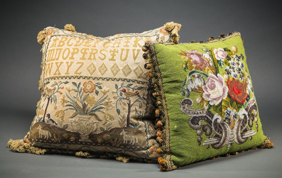 TWO FINE ENGLISH NEEDLEPOINT PILLOWSThe first, 18th century, resembling a sampler with alphabet and