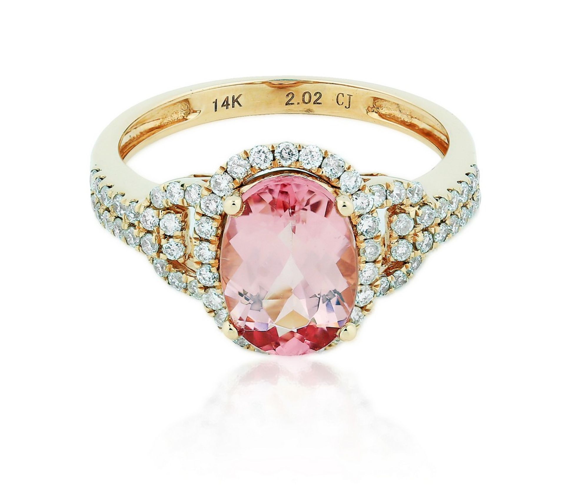 SPINEL AND DIAMOND RING Spinel and Diamond Ring Centering an oval-cut pink spinel weighing