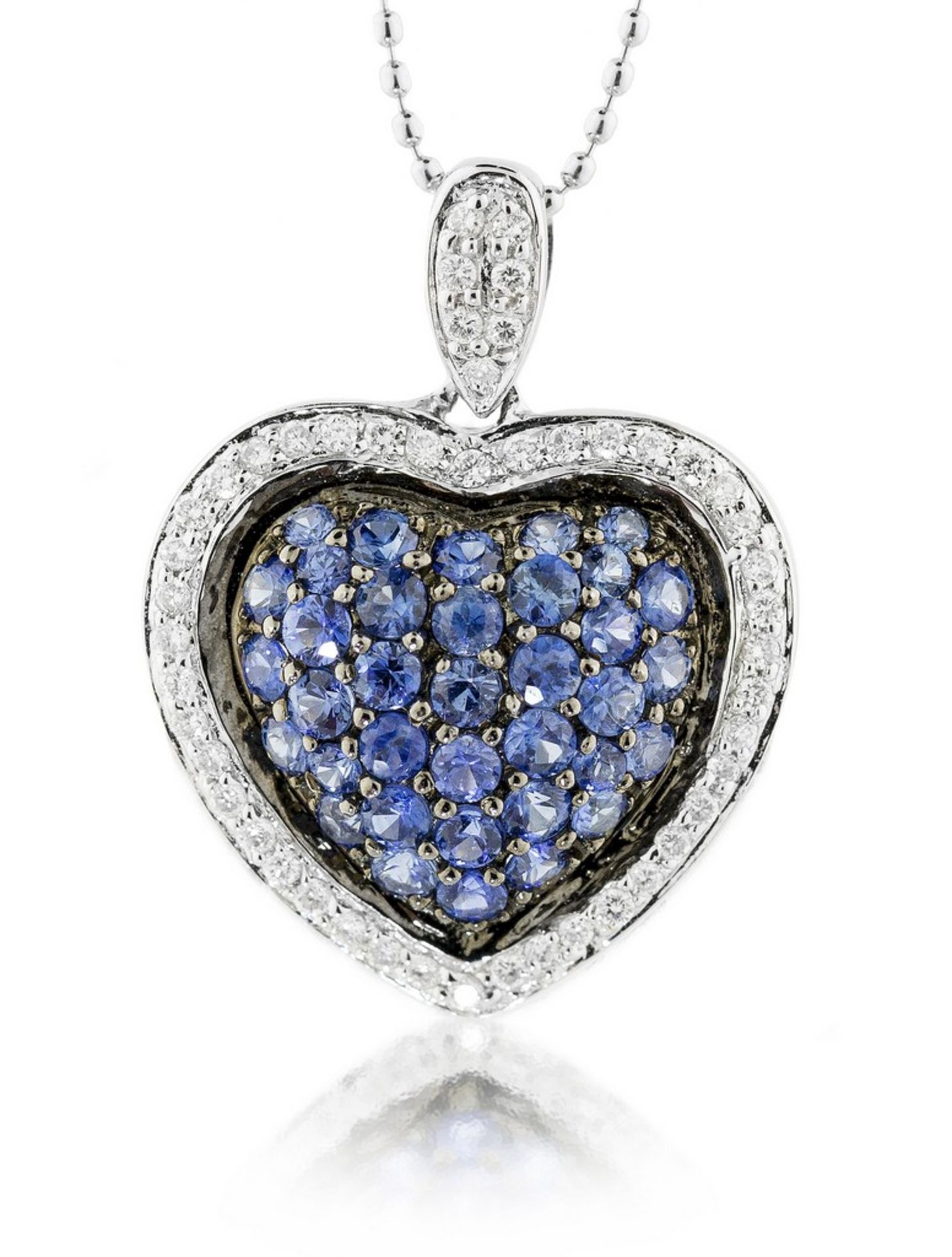 SAPPHIRE AND DIAMOND 'HEART' PENDANT Centered pavi-set sapphires weighing approximately 0.54 carats,