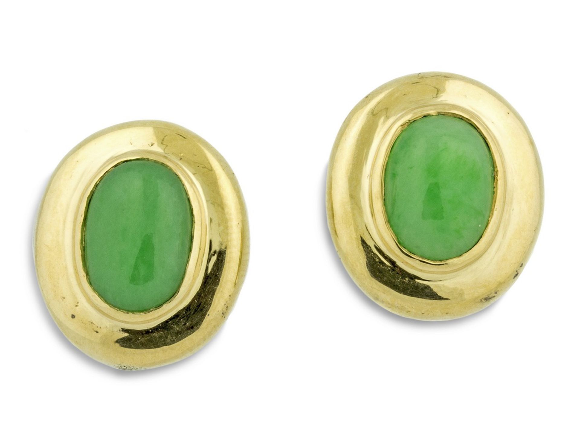 YELLOW GOLD JADE EAR CLIPS Centering an oval cabochon-cut green jade, surrounded by a gold frame,