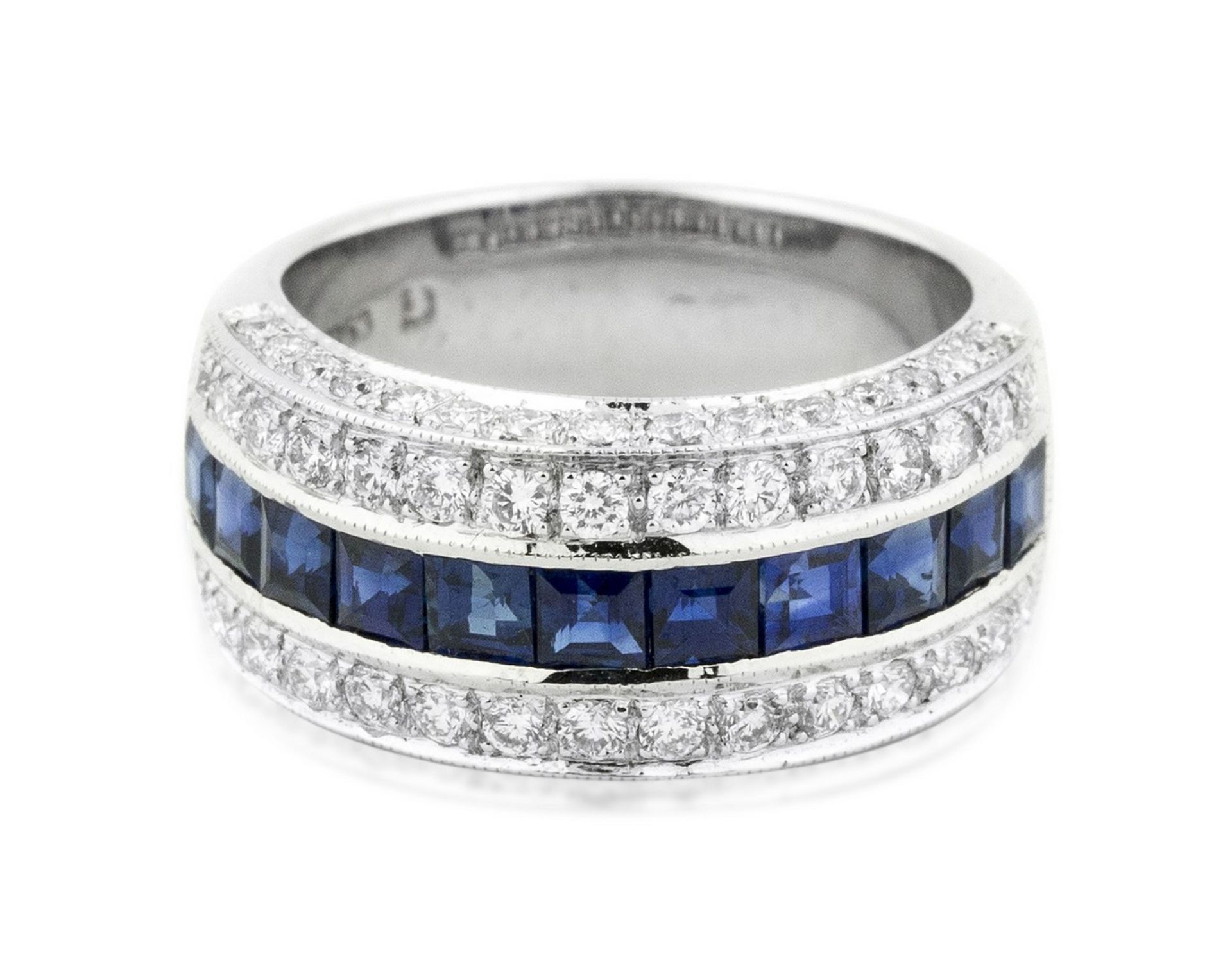 18 KARAT WHITE GOLD SAPPHIRE AND DIAMOND RING The band ring set with calibri-cut sapphires,