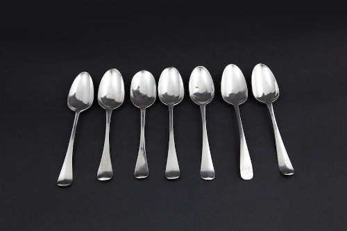 A MATCHED SET OF SIX HANOVERIAN PATTERN SILVER TABLE SPOONS, London circa 1772; and an Old English
