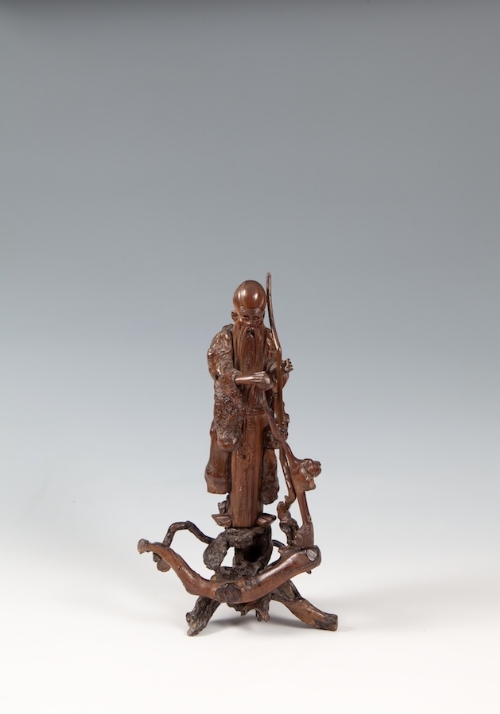 A JAPANESE ROOTWOOD CARVING OF FUKUROKUJU, 19th century, the God of Wisdom, modelled in standing