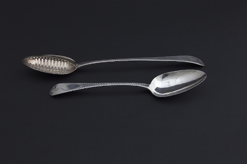 AN IRISH GEORGE III BRIGHT CUT ENGRAVED SILVER BASTING SPOON, Dublin 1805, the long tapering