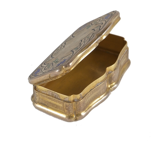 A SILVER-GILT AND ENAMELLED SHAPED RECTANGULAR SNUFF BOX, French 19th Century, with head of