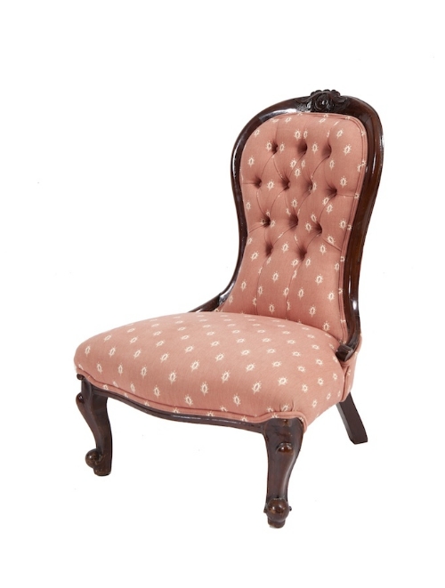 A VICTORIAN MAHOGANY FRAMED WAISTED-BACK LOW CHAIR, with serpentine seat, buttoned pink upholstery