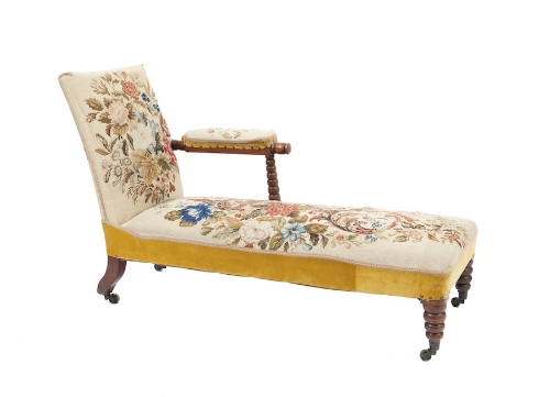 A VICTORIAN MAHOGANY NARROW FRAMED CHAISE LONGUE, with padded rectangular back, embroidered