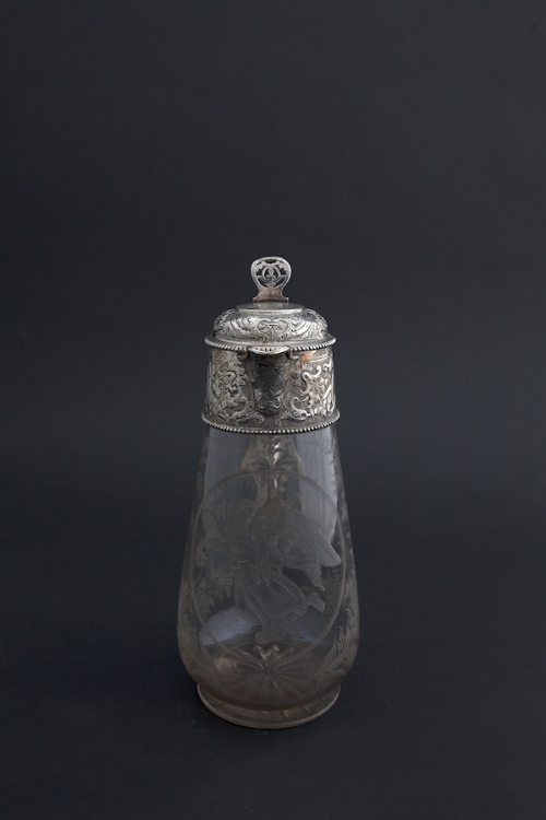 A VICTORIAN CUT GLASS AND SILVER MOUNTED CLARET JUG, Sheffield 1883-84, the hinged domed cover