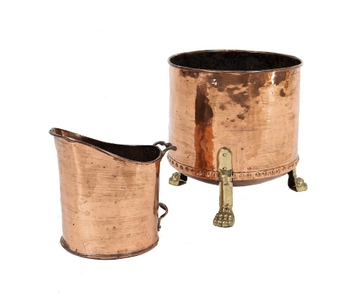 A LARGE CIRCULAR DRUM SHAPED COPPER TURF BUCKET, with studded base and raised on three hairy paw