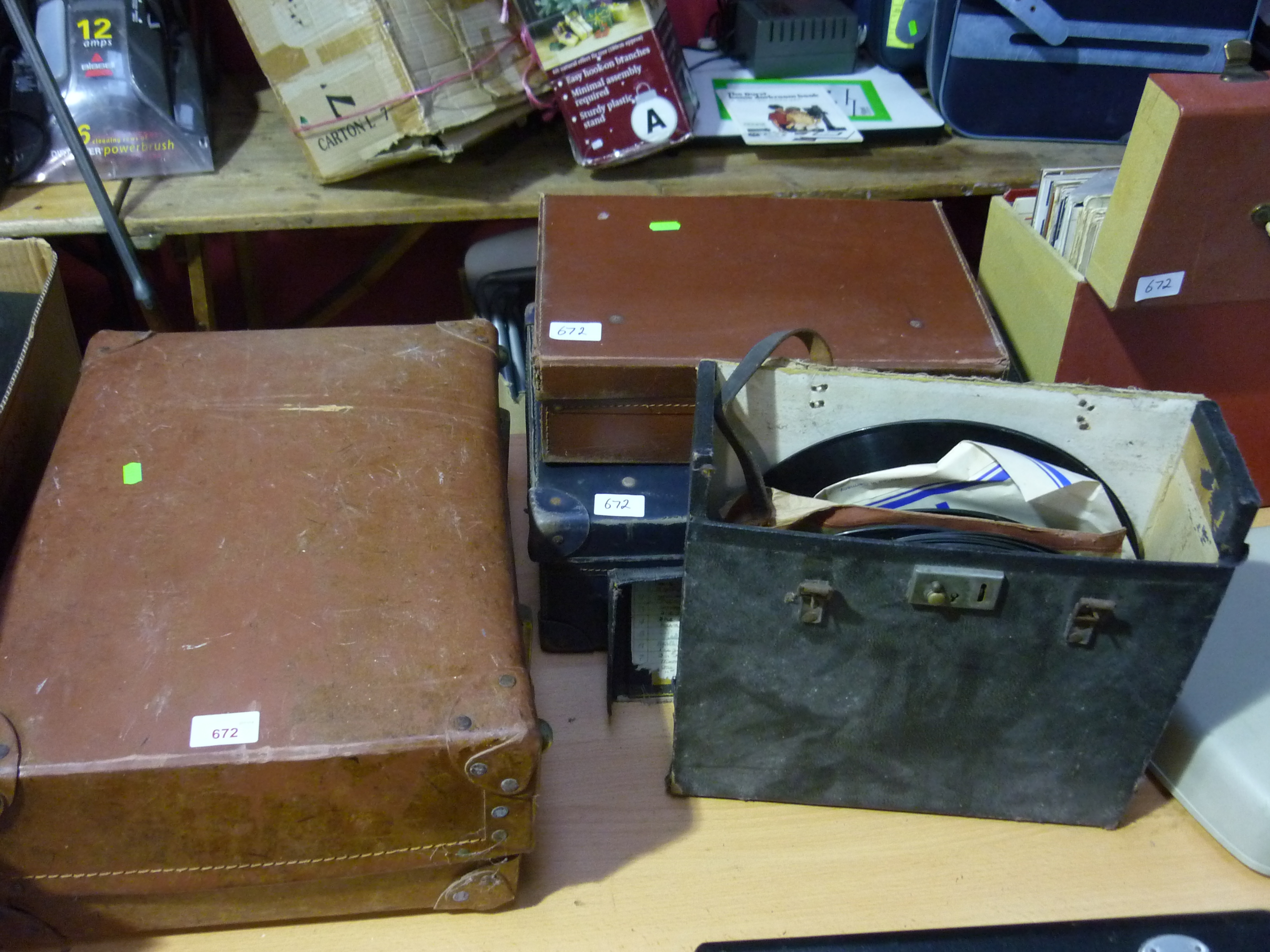 A group comprising: three vintage leather cases,  two cases of 78`s and LP`s and a vintage