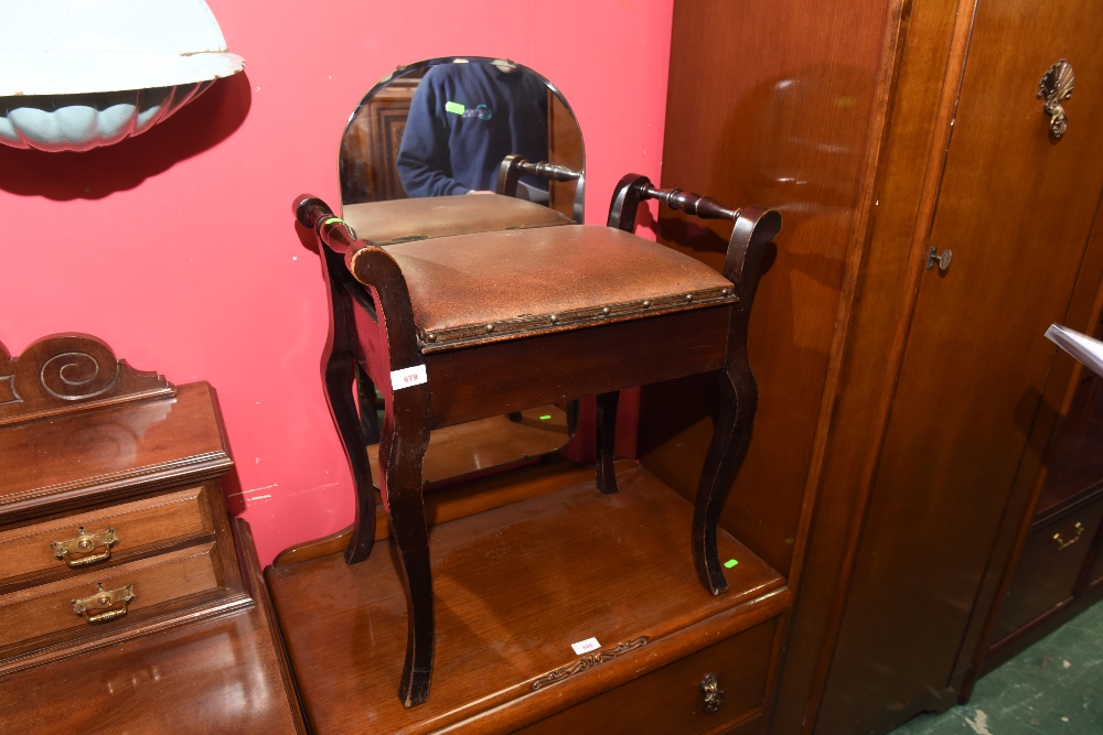 A mahogany piano stool