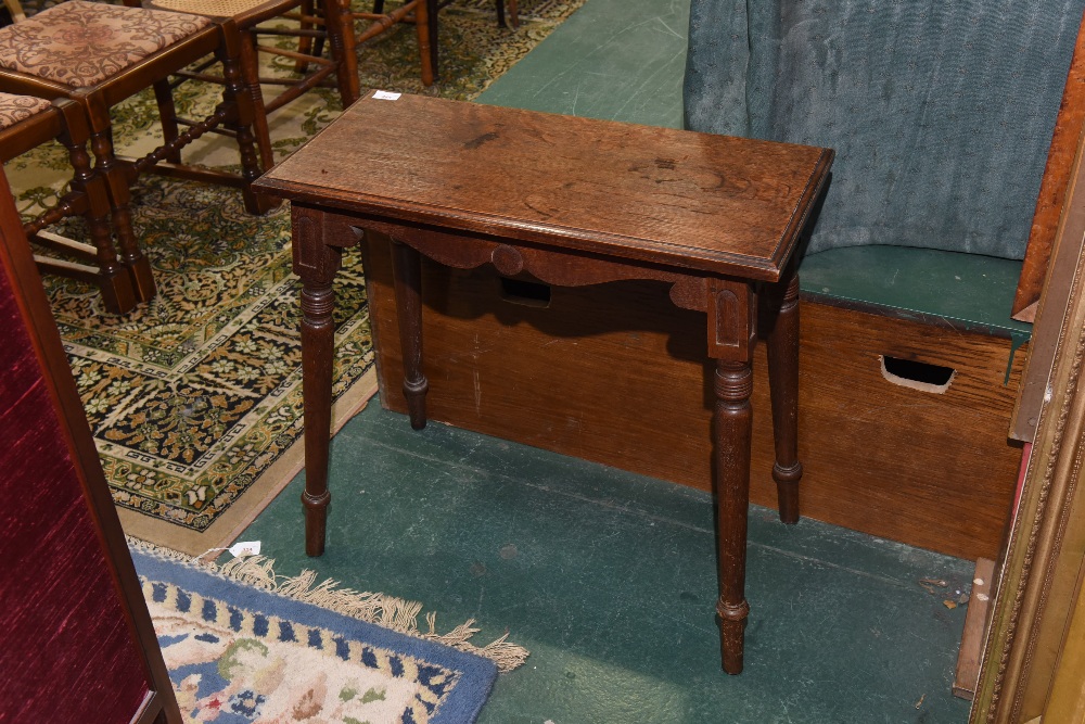 An oak side table in Arts and Crafts style
