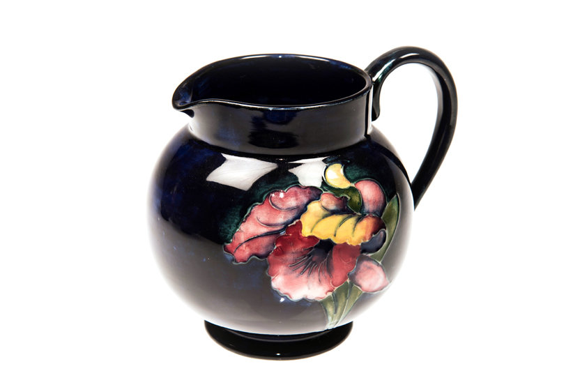 A WALTER MOORCROFT POTTERY MILK JUG, c.1950, tubelined and hand painted in the `Iris` pattern,