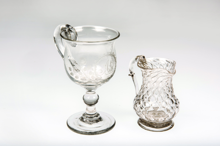 AN 18th CENTURY "NIPT-DIAMOND-WAIES" GLASS CREAM JUG, of baluster form with moulded scroll handle;