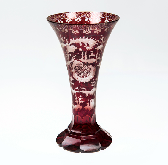 A 19th CENTURY BOHEMIAN RED FLASH GLASS VASE, decorated with stags and rococo cartouches. 19cm