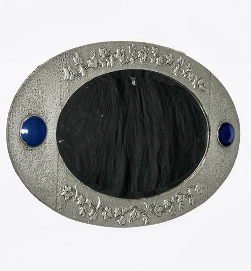 AN EARLY 20th CENTURY PEWTER MIRROR IN THE ARTS AND CRAFTS TASTE, the oval plate within a conforming