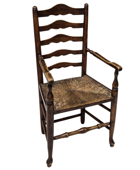 A 19th CENTURY ASH LADDERBACK OPEN ARMCHAIR, of Lancashire type, with rush seat.