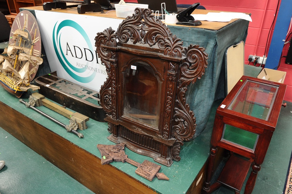 A 19th century Goan carved hardwood glazed display cabinets, tog. with a carved wooden cross