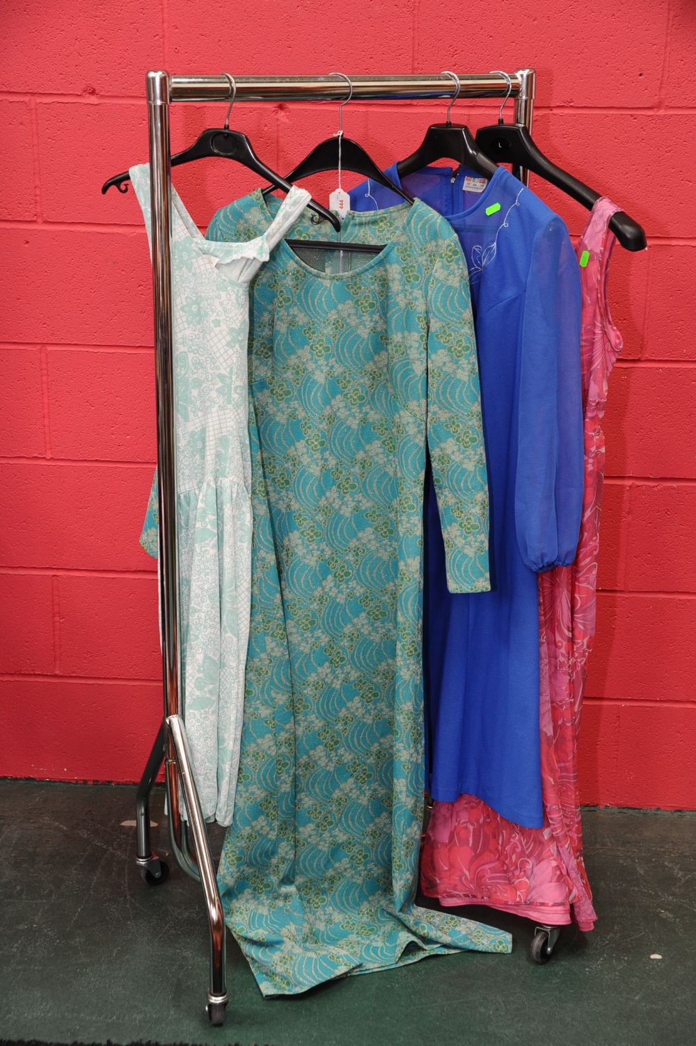 A group of lady`s vintage clothes inc. a 1970`s turquoise/gold maxi dress, a blue long sleeved