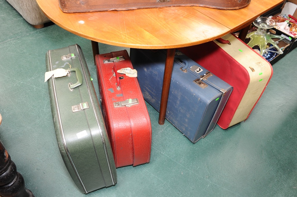 Four vintage suitcases