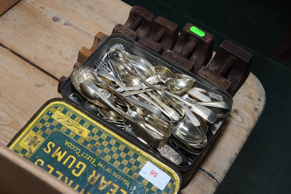 A group of silverplate and mother of pearl handled flatware, tog, with a set of graduated scale