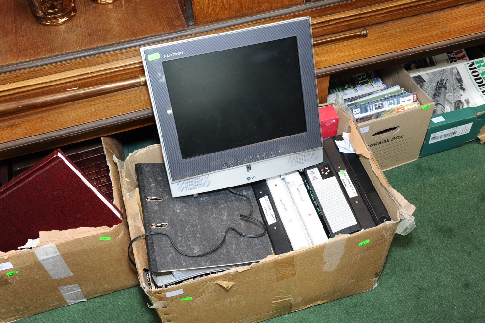 A box of sheet music tog. with an LG flat screen television