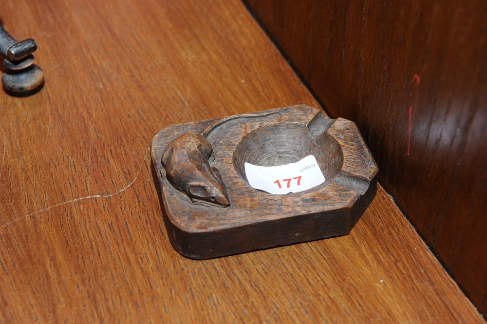 A Robert Mouseman Thompson oak ashtray with caved mouse signature.